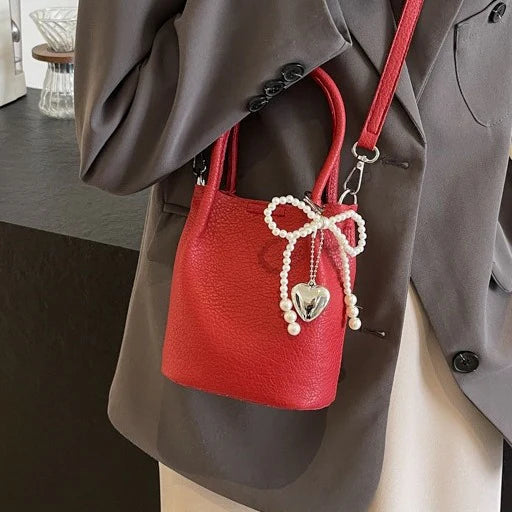 ELEGANT-PEARL-ACCENT BUCKET BAG